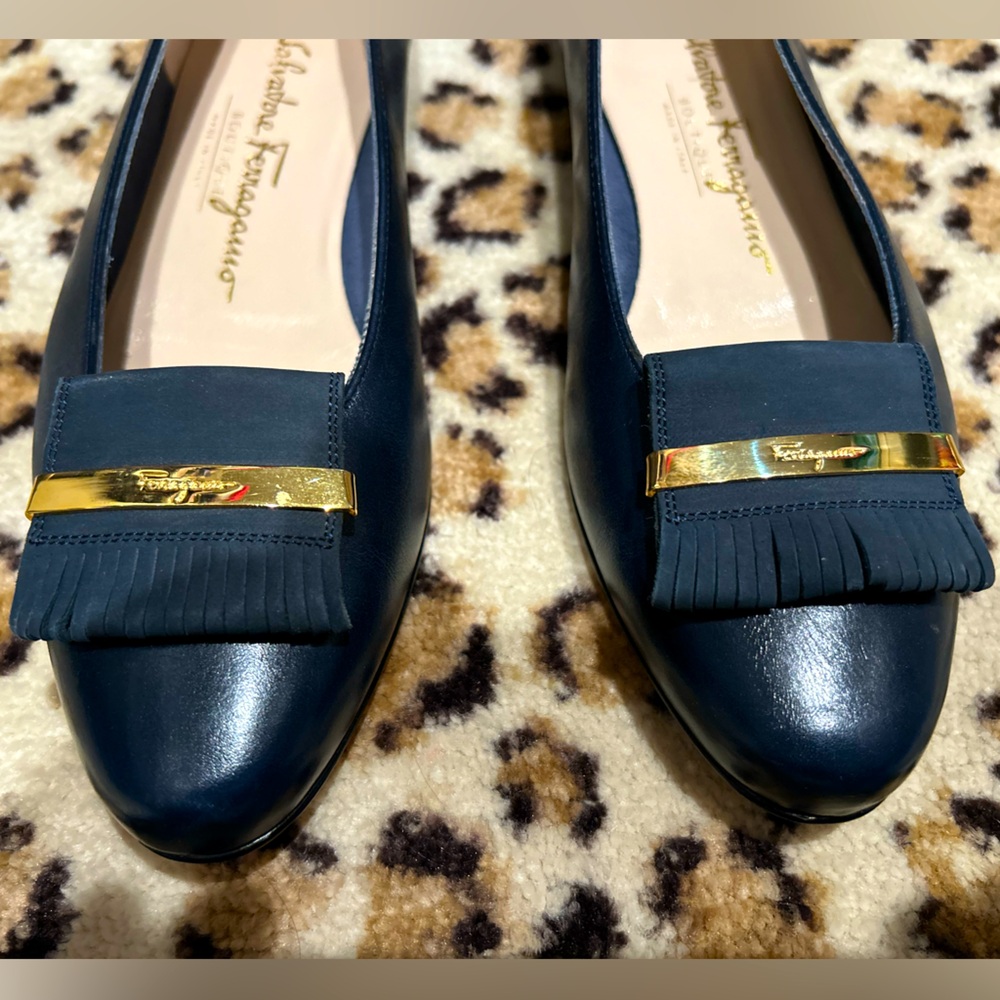 Leather navy flats by Salvatore Ferragamo in size 7. Made in Italy
